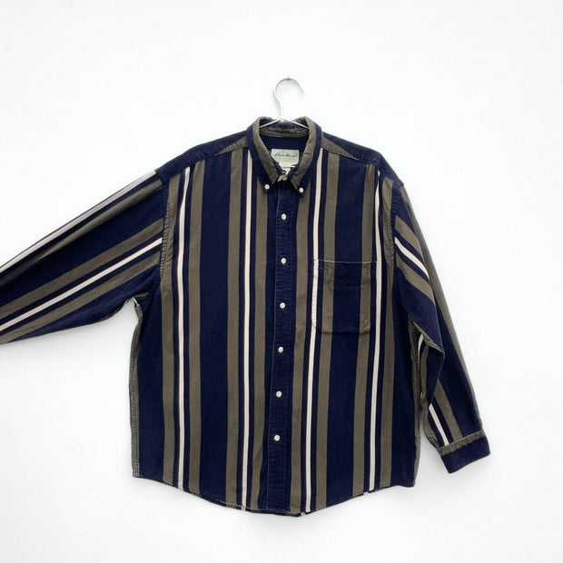 Eddie Bauer Striped Corduroy Button-up Shirt. Navy, Olive, Cream Vertical Stripes. Men’s Large, Flannel Shirt with arm extended.