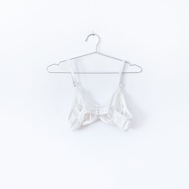 Back of White Vintage Silk Bra/Bralette 40A. Adjustable Straps, Elastic Band with Two Clasps. Vintage Clothing Canada.