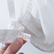 Back of White Vintage Silk Bra/Bralette 40A/B. Close-up of Back Elastic and Size Reading 40A. Online Canadian Vintage.