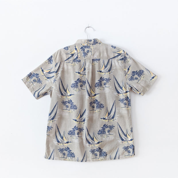 Beige Croft & Barrow Button-up Short Sleeve Shirt with Large Dark Blue Boats and Palm Trees. Back View. Fold and Fray.