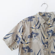 Beige Croft & Barrow Button-up Short Sleeve Shirt with Large Dark Blue Boats and Palm Trees. Size Medium. Close Up.