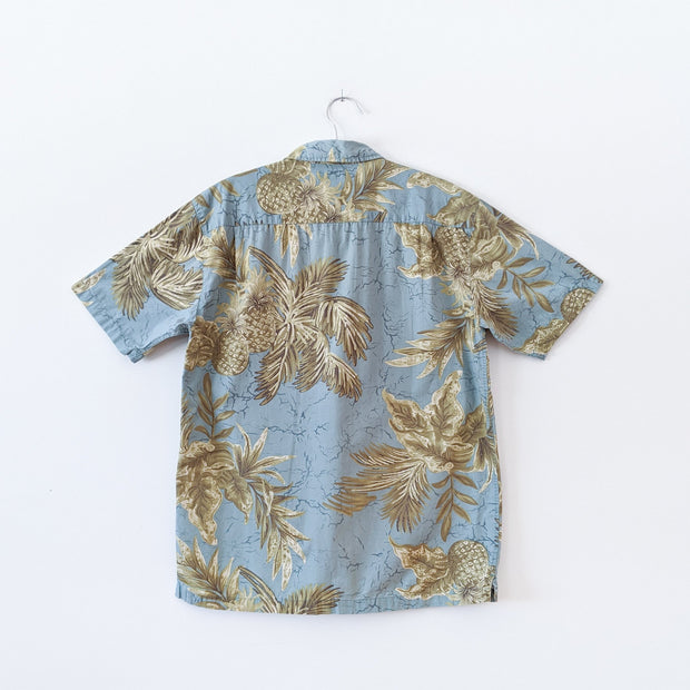 Retreat Short Sleeve Button-up Hawaiian Shirt. Light Teal Tropical Print Yellow and Green Pineapples. Back View. 