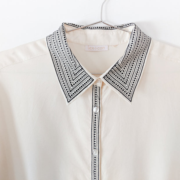 Vintage Lex-i-con Womens Button-up ¾ Sleeve Shirt. Cream with Black Embroidery at Collar and Front Buttons.