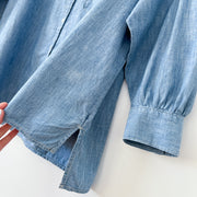 Close-up of Side Slit, Hem Length and Puffed Cuff on GAP Oversized Cocoon Shirt. Light Blue Chambray Button-up Shirt, Women’s XS.