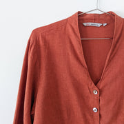 Deep V-Neckline on Button-up Shirt with Mother of Pearl Buttons. Rust Orange/Red Hemp/Tencel Fabric. Canada.