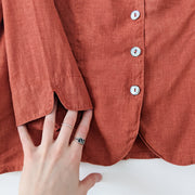 Curved Bottom Hem, and Small Slit on Sleeve of Rust Orange Hemp/Tencel Button-up Shirt by TSD Two Star Dog. Fold and Fray.