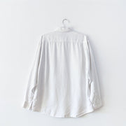 Back of white linen long sleeve button-down shirt.