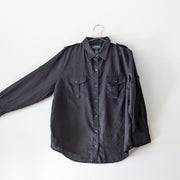 Black linen button-up shirt, shown with the sleeve extrended to indicate sleeve width.