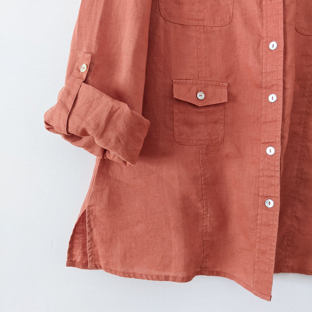 Close up Rolled-up Sleeve with Tab and Mother of Pearl Button. Linen Fabric on Light/Rusty Orange Conrad C Collection Shirt.