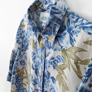 Vintage Jessie Blue Floral Button-up Long Sleeve Shirt. Close-up: Blue Flowers, Green Leaves, Off-White Background. Collar.