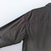 Wilfred Free Button-up Long Sleeve Corduroy Shirt. Dark Green, Back of Arms have Seam extending from Yoke to Cuff. Close-up