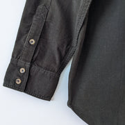 Wilfred Free Button-up Long Sleeve Corduroy Shirt in Dark Green, Large. Close-up of Cuffs with Light Brown Buttons.