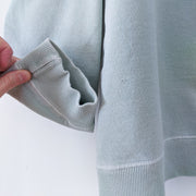 Close-up of Cuffs on Vintage Northern Reflections Crewneck Sweatshirt in Light Mint/Seafoam Green. Women's Petite Large.