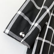 Close up of Sleeve Cuff with Vintage Button on Black and White Windowpane Print Vintage Bianca Blazer. Vintage Clothing Canada.