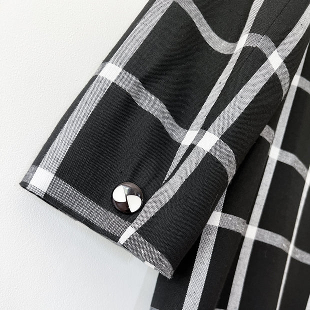 Close up of Sleeve Cuff with Vintage Button on Black and White Windowpane Print Vintage Bianca Blazer. Vintage Clothing Canada.