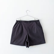 Black cotton shorts with no pockets on the back.