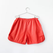 Vintage 90's Magic Mountain Preshrunk Cotton Shorts in Bright Red-Orange, Women’s Large. Elastic Waist, Curved Hem at Side.