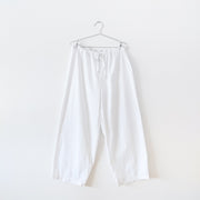 White cotton pyjama pants with straight leg and drawstring and elastic waist. Secondhand gender and size inclusive clothing from Fold and Fray.