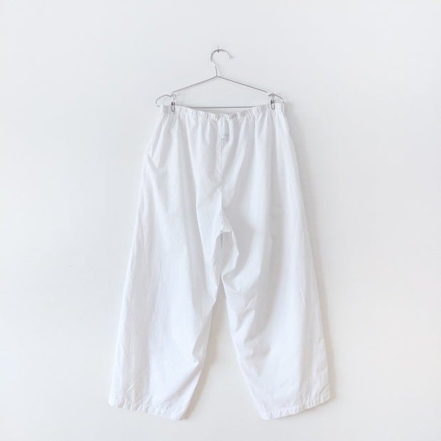 Back of White cotton pyjama pants with straight leg and drawstring and elastic waist. Secondhand gender and size inclusive clothing from Fold and Fray.