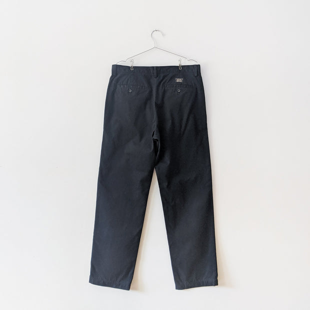 Black cotton chinos with back welt pockets that button.