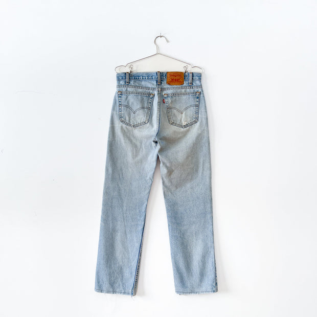 Vintage Levi’s 516 32X32 Slim Fit Straight Leg Faded Light Blue Jeans, Fraying at Back Pockets, Red Tab, Made in Canada.
