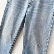 Legs with Distressing and Small Hole at Knee on Vintage Levi’s 516 32X32 Slim Fit Straight Leg Jeans, Made in Canada.