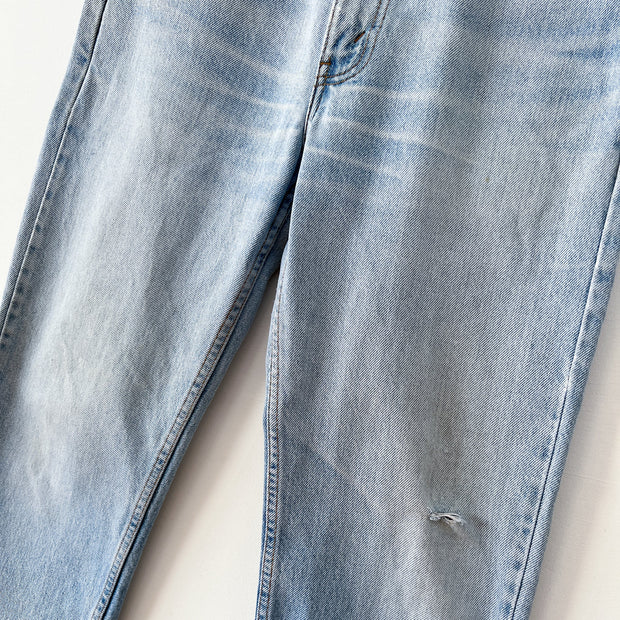 Legs with Distressing and Small Hole at Knee on Vintage Levi’s 516 32X32 Slim Fit Straight Leg Jeans, Made in Canada.