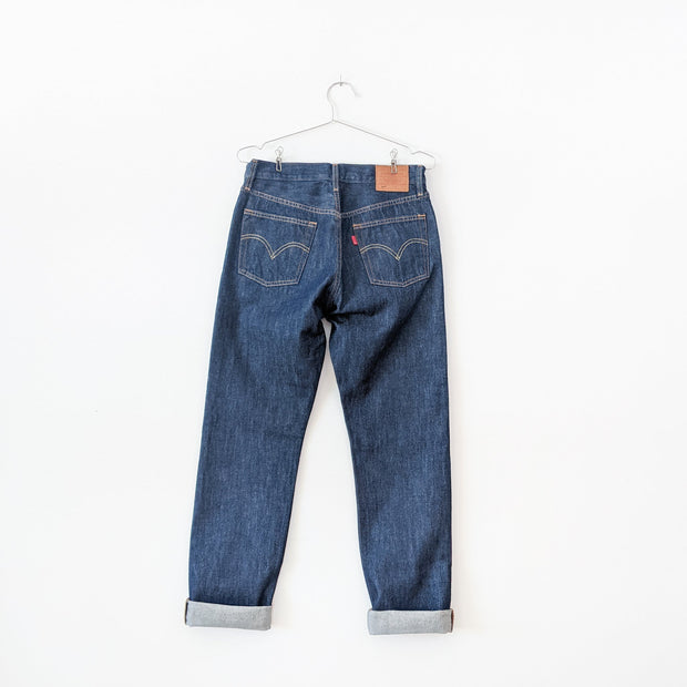 Levi's 501 Original Fit Dark Wash “Across A Plain” High-rise Blue Jean, Cuffed Hem. Women's 28X30. Back of Jeans, Red Tag.