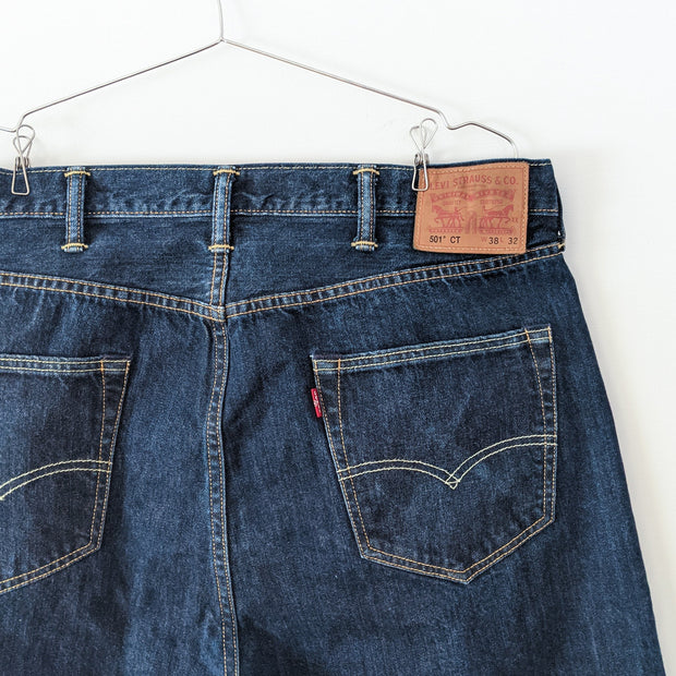 Levi's 501 CT (Customized and Tapered Style) Dark Wash Blue Jean Men’s 38X32. Back Pocket Close-up Red Tag.