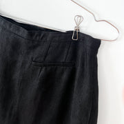 Back of Skirt. Welt Pocket, Narrow Waistband, Black Linen Fabric on Vintage Hechter Basics Black Linen Wrap Skirt.