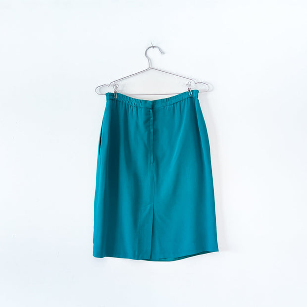 Back of Vintage Teal Silk Skirt, YL by Yair Petites Women’s 6. Highwaisted Silk Skirt, Hidden Zipper and Bottom Black Slit.