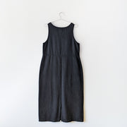 Cotton maxi shift dress in black, sleeeless, back of dress with slit at the bottom.