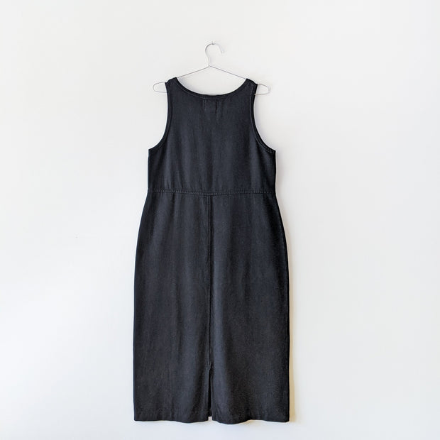 Cotton maxi shift dress in black, sleeeless, back of dress with slit at the bottom.