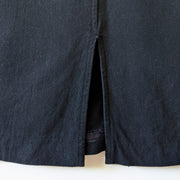 Cotton maxi shift dress in black, close up of back slit.