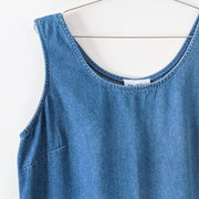 Vintage Panache Blue Denim Sleeveless Maxi Dress. Mid-Tone Solid Wash Blue. Close up of Sleeves, Scoop Neck. Made in Canada.