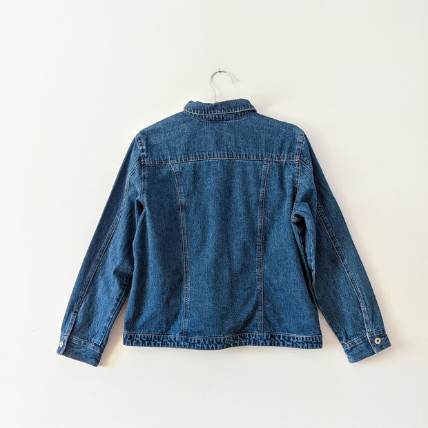 Cotton denim jacket in Indigo Blue with collar, back view.