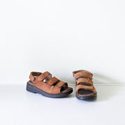 Deer Stags Brown Leather Slingback Sandals. Three Front Straps, One Back Strap, Black Sole. Front View.