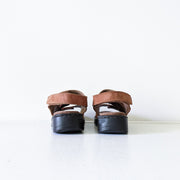 Deer Stags Brown Leather Slingback Sandals. Three Front Straps (Velcro), One Back Strap, Black Sole. Back View, Heels.