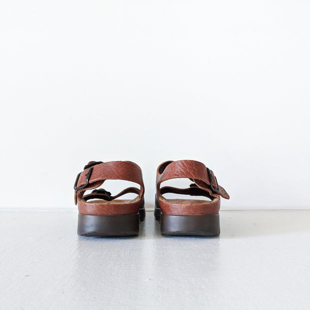 Back view of heels on Chestnut Brown leather Mephisto sandals. Open heel with one back strap.