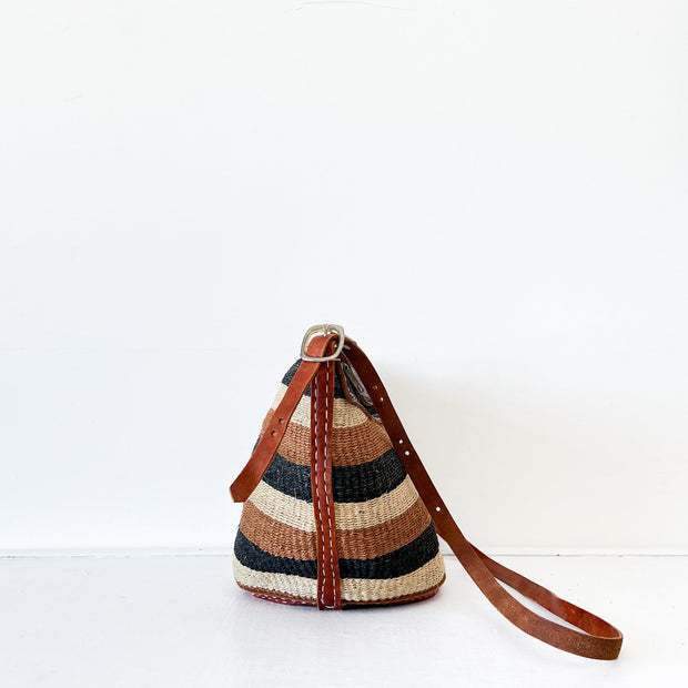 Vintage Woven, Jute Purse. Brown/Black Horizontal Stripe Base, Embossed Leather Top, Handle, Adjustable Strap. Side View.