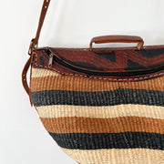 Close up of Dark Brown and Black Embossed Leather and Handle on Top of Brown/Black Striped Jute Purse, Shoulder Bag.