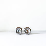 Bottom View of Plugs on Vintage Mid Century Modern Stainless Steel Salt and Pepper Shakers. Vintage Home Goods in Canada.